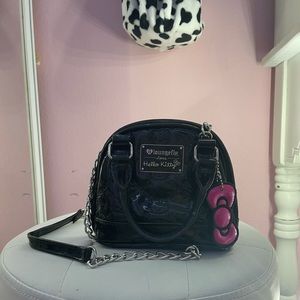a very cute hello kitty purse